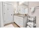 Bathroom features a granite countertop vanity, white cabinets, and decorative storage at 501 Preservation Dr, Fort Mill, SC 29715