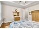 Bedroom featuring hardwood floors, tray ceilings, and a neutral color scheme at 501 Preservation Dr, Fort Mill, SC 29715