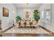 Elegant dining room with hardwood floors, a large wooden table, and plenty of natural light at 501 Preservation Dr, Fort Mill, SC 29715
