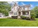 Charming two-story home with a welcoming front porch and well-manicured lawn, perfect for curb appeal at 501 Preservation Dr, Fort Mill, SC 29715