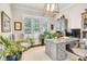 Well-lit home office with plenty of natural light, a modern desk, and built-in shelving at 501 Preservation Dr, Fort Mill, SC 29715
