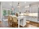 Bright kitchen with a large island, stainless steel appliances and modern pendant lighting at 501 Preservation Dr, Fort Mill, SC 29715