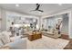 Open concept living area seamlessly connects to the kitchen and staircase for modern living at 501 Preservation Dr, Fort Mill, SC 29715