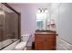 Stylish bathroom showcasing a tub with shower, granite countertop vanity and a sleek design at 512 Appomatox Dr, Marvin, NC 28173