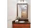 Bathroom vanity features a granite countertop, framed mirror, and warm lighting, blending functionality with style at 512 Appomatox Dr, Marvin, NC 28173