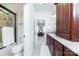 Bathroom featuring walk-in shower, granite counters, and wood cabinets at 512 Appomatox Dr, Marvin, NC 28173