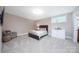 This bedroom boasts neutral walls, carpeted floors, and a large window for natural light at 512 Appomatox Dr, Marvin, NC 28173