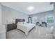 Bright bedroom features ample natural light, a comfortable king bed, and a functional desk area at 512 Appomatox Dr, Marvin, NC 28173