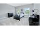 Cozy bedroom with neutral carpet, two windows, and ample natural light at 512 Appomatox Dr, Marvin, NC 28173
