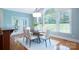 Bright dining room with large windows, wood floors, and modern chandelier at 512 Appomatox Dr, Marvin, NC 28173