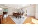Formal dining room featuring a chandelier, hardwood floors, and elegant wainscoting at 512 Appomatox Dr, Marvin, NC 28173