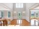 Bright, open foyer with hardwood floors, glass paneled entry door and transom window above at 512 Appomatox Dr, Marvin, NC 28173