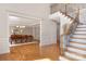 Foyer view of the dining room and staircase, with hardwood floors and decorative trim at 512 Appomatox Dr, Marvin, NC 28173