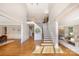 Grand foyer with hardwood floors, staircase with iron railings, and trim accents at 512 Appomatox Dr, Marvin, NC 28173
