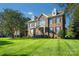 Beautiful brick two-story home with manicured lawn, dormer windows, and elegant entry at 512 Appomatox Dr, Marvin, NC 28173