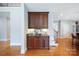 Hallway view of cabinetry, countertop, tile backsplash, and hardwood floors at 512 Appomatox Dr, Marvin, NC 28173