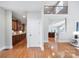 Hallway view showcases hardwood floors and cabinetry leading into an open and bright living space at 512 Appomatox Dr, Marvin, NC 28173