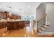 Spacious kitchen with wood cabinets, granite counters, breakfast bar and wood floors at 512 Appomatox Dr, Marvin, NC 28173