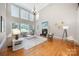 Bright living room with high ceilings, large windows, fireplace, and modern decor creating a cozy atmosphere at 512 Appomatox Dr, Marvin, NC 28173