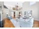 Spacious living room boasts an open floor plan, modern decor, and a soaring two-story ceiling at 512 Appomatox Dr, Marvin, NC 28173