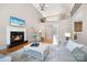 Bright, open living room featuring a cozy fireplace and a view of the upper level at 512 Appomatox Dr, Marvin, NC 28173