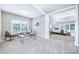 Inviting living room with natural light and neutral tones flowing into an adjacent bedroom suite at 512 Appomatox Dr, Marvin, NC 28173