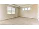 Bright bedroom with carpeted floors and plenty of natural light from windows at 5205 Raging Creek Dr # 122, Indian Trail, NC 28079