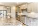 Bright kitchen features granite counters, stainless steel appliances, undermount sink, and sleek gray cabinets at 5205 Raging Creek Dr # 122, Indian Trail, NC 28079