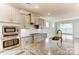 Kitchen with island, granite countertops, stainless steel appliances, and ample cabinet space for storage at 5205 Raging Creek Dr # 122, Indian Trail, NC 28079