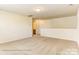 Open living space with neutral carpet and view into another room at 5205 Raging Creek Dr # 122, Indian Trail, NC 28079