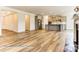Open floor plan featuring kitchen, living room, and breakfast nook with hardwood floors and lots of light at 5205 Raging Creek Dr # 122, Indian Trail, NC 28079