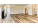 Bright, open living space with hardwood flooring and a fireplace that leads to other parts of the home at 5205 Raging Creek Dr # 122, Indian Trail, NC 28079