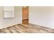 Nice living room with decorative wall trim, wood floors, and view to next room at 5205 Raging Creek Dr # 122, Indian Trail, NC 28079