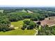 Drone eye-view showcasing vast acreage, highlighted by thriving trees and grassy plains at 5740 Crouse Rd, Crouse, NC 28033
