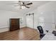 Bedroom with wood-look floors, double door closet, and office area at 5740 Crouse Rd, Crouse, NC 28033