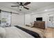 Bedroom with a sliding barn door, ceiling fan, and private bathroom at 5740 Crouse Rd, Crouse, NC 28033