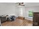 Bedroom with wood-look floors featuring a desk, chair, and closet at 5740 Crouse Rd, Crouse, NC 28033