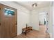 Bright entry features wood floors, white walls, bench and a stylish front door with glass at 5740 Crouse Rd, Crouse, NC 28033