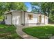 Charming one-level home featuring white siding, wood accents, and a lovely green lawn at 5740 Crouse Rd, Crouse, NC 28033