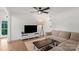 Open living room features sleek TV console and modern ceiling fan at 5740 Crouse Rd, Crouse, NC 28033