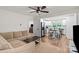 Open-concept living room flows into kitchen with modern finishes, stainless steel appliances, and bar seating at 5740 Crouse Rd, Crouse, NC 28033