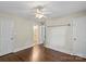 Bedroom with hardwood floors and a connecting bathroom with a view of a vanity at 5811 Gettysburg Dr, Concord, NC 28027