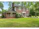Traditional two-story brick home with black shutters and a well-maintained lawn at 5811 Gettysburg Dr, Concord, NC 28027