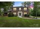 Charming two-story brick home with a manicured lawn and classic black shutters and trim at 5811 Gettysburg Dr, Concord, NC 28027