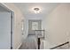 Upstairs hallway featuring plush carpeting, neutral paint, and access to multiple rooms at 5811 Gettysburg Dr, Concord, NC 28027