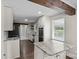 Updated kitchen featuring granite countertops and stainless steel appliances at 5811 Gettysburg Dr, Concord, NC 28027