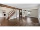 Spacious living area with hardwood floors, a fireplace, and natural light at 5811 Gettysburg Dr, Concord, NC 28027