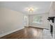 Bright living room with hardwood floors, white trim, and a brick fireplace at 5811 Gettysburg Dr, Concord, NC 28027