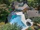 Backyard aerial view with a pool, patio area, and well-manicured landscaping at 629 Wingrave Dr, Charlotte, NC 28270