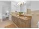 Bathroom featuring double sinks, vintage vanity and finishes, and a glass-enclosed shower at 629 Wingrave Dr, Charlotte, NC 28270